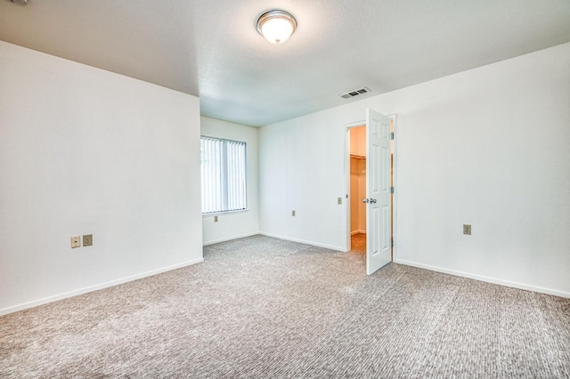 unfurnished room with carpet flooring