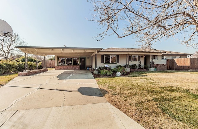 view of front facade with a front lawn and a carport