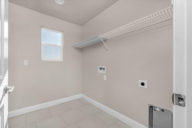 laundry area with electric dryer hookup, washer hookup, and light tile patterned floors