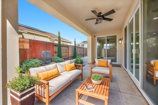 exterior space featuring ceiling fan and an outdoor living space