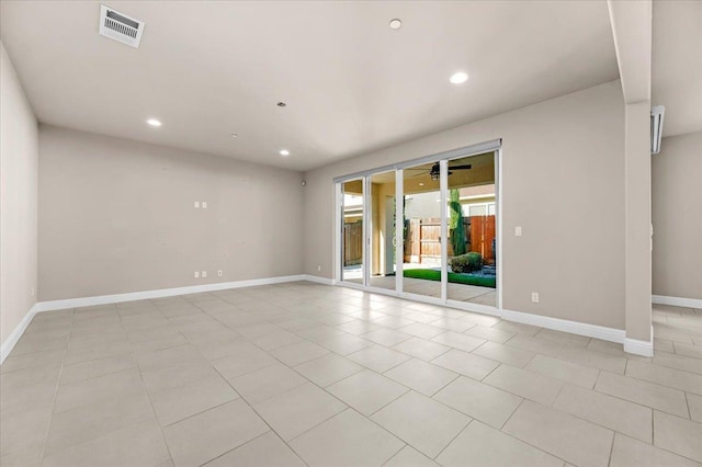 tiled empty room with ceiling fan