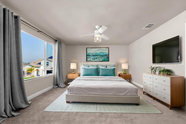 carpeted bedroom with ceiling fan