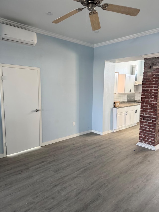 unfurnished living room with crown molding, wood finished floors, a wall mounted air conditioner, and ceiling fan