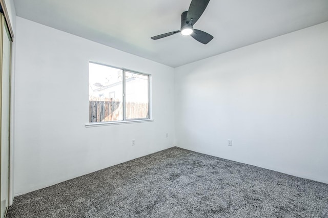 unfurnished room featuring carpet flooring and ceiling fan