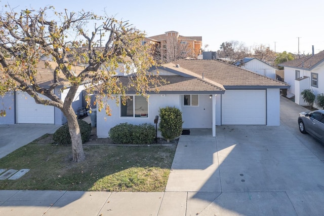 view of front facade with a garage and a front lawn