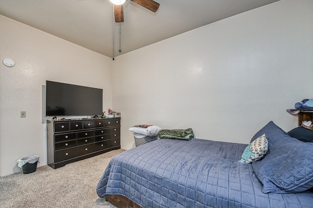 bedroom featuring vaulted ceiling, ceiling fan, and carpet flooring