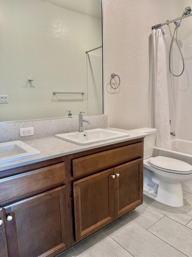 full bathroom with shower / bath combo, vanity, tile patterned floors, and toilet