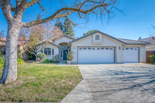 ranch-style home with a garage and a front lawn