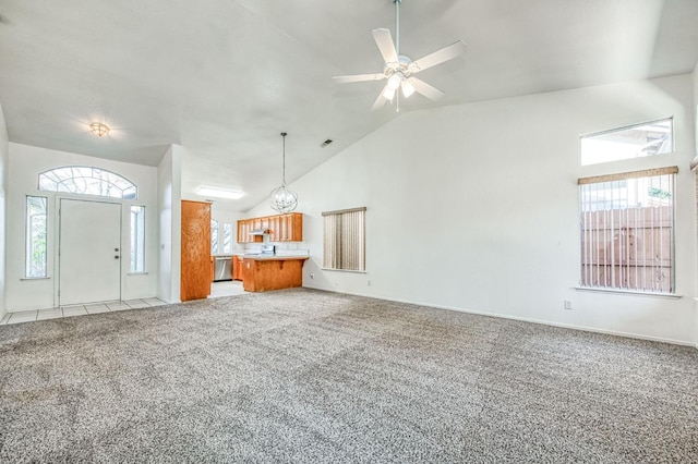 unfurnished living room featuring ceiling fan, light colored carpet, and lofted ceiling