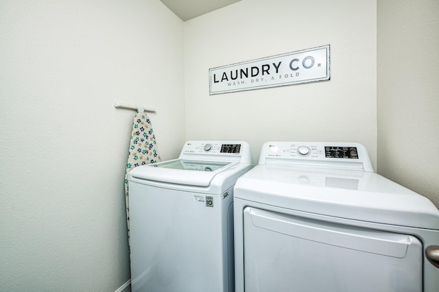 laundry area with washer and clothes dryer