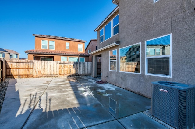 exterior space featuring central AC unit and a patio