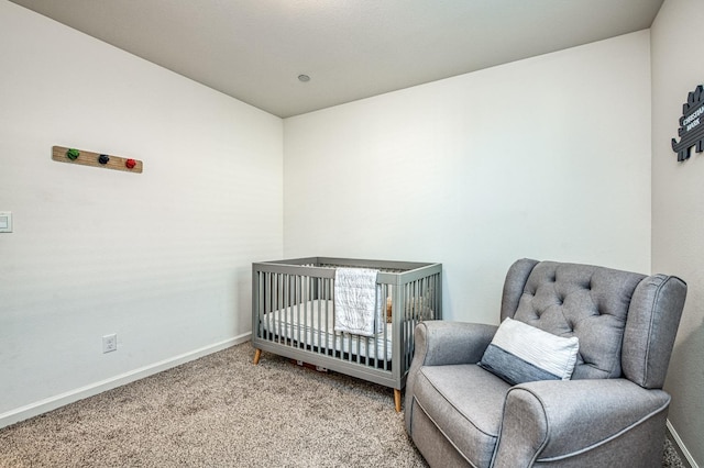 carpeted bedroom with a crib