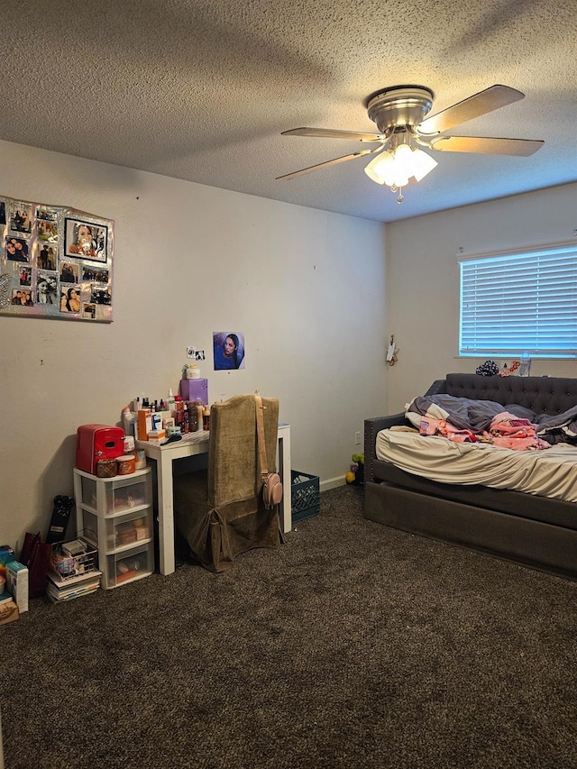 carpeted bedroom with a textured ceiling and ceiling fan