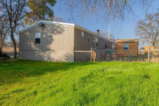 back of house with a yard