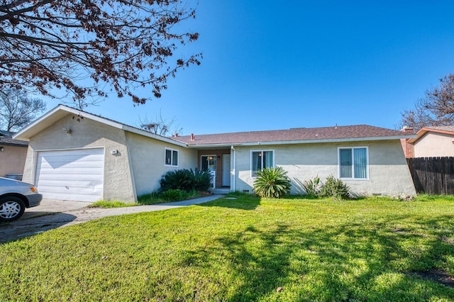 ranch-style home featuring a garage and a front lawn