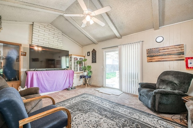 carpeted living room featuring ceiling fan, a textured ceiling, wood walls, and vaulted ceiling with beams