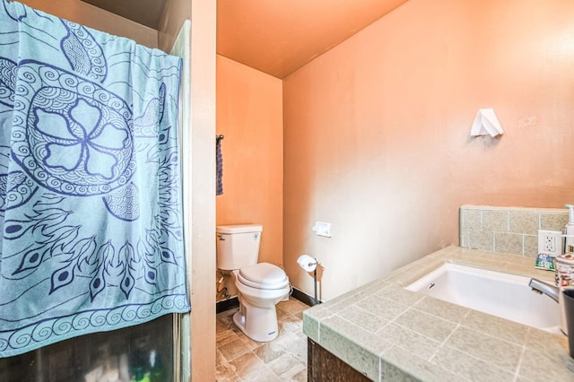 bathroom featuring sink and toilet