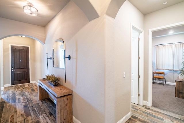 entryway with hardwood / wood-style flooring