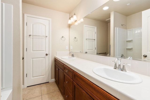 bathroom featuring tile patterned flooring and vanity