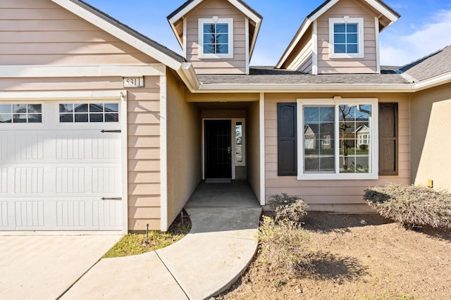 entrance to property featuring a garage