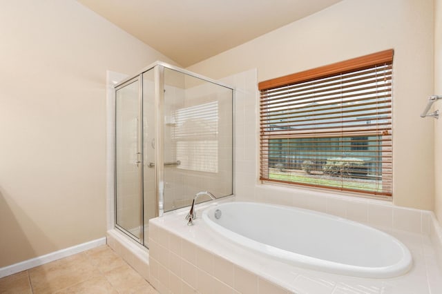 bathroom with vaulted ceiling, tile patterned floors, and shower with separate bathtub