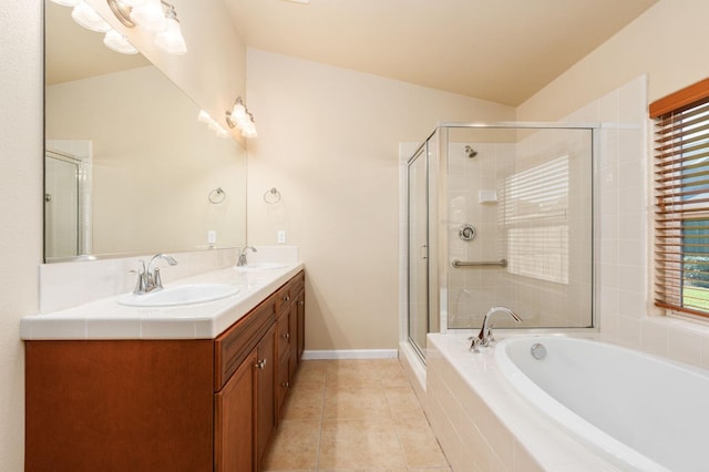 bathroom featuring vaulted ceiling, plus walk in shower, vanity, and tile patterned flooring