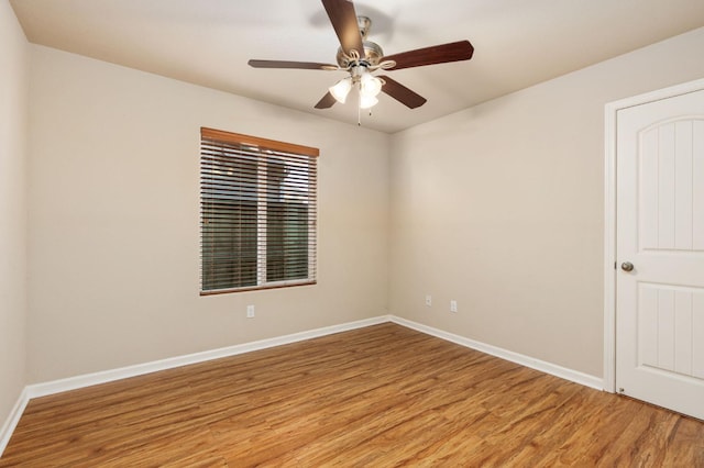 empty room featuring light wood-type flooring and ceiling fan