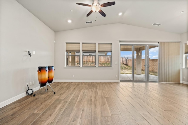 unfurnished living room featuring lofted ceiling, ceiling fan, and light hardwood / wood-style flooring