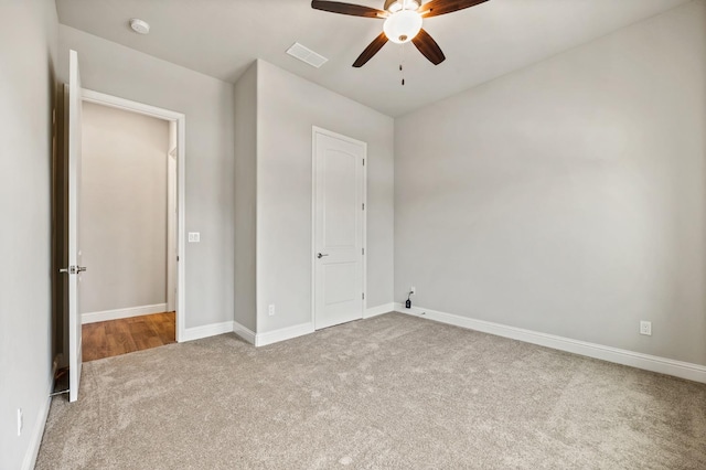 unfurnished bedroom featuring ceiling fan and carpet flooring