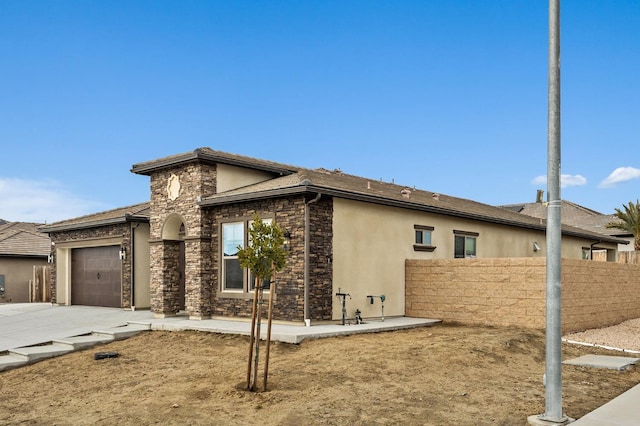 view of property exterior with a garage