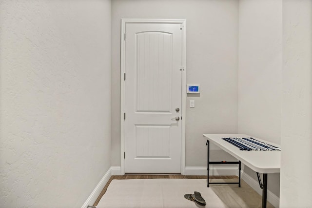 doorway to outside featuring hardwood / wood-style flooring