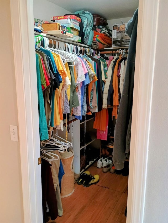 spacious closet featuring hardwood / wood-style floors