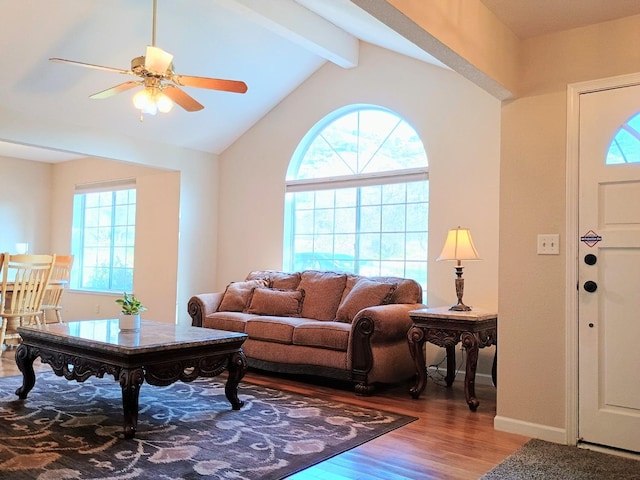 living room featuring lofted ceiling with beams, ceiling fan, and hardwood / wood-style floors