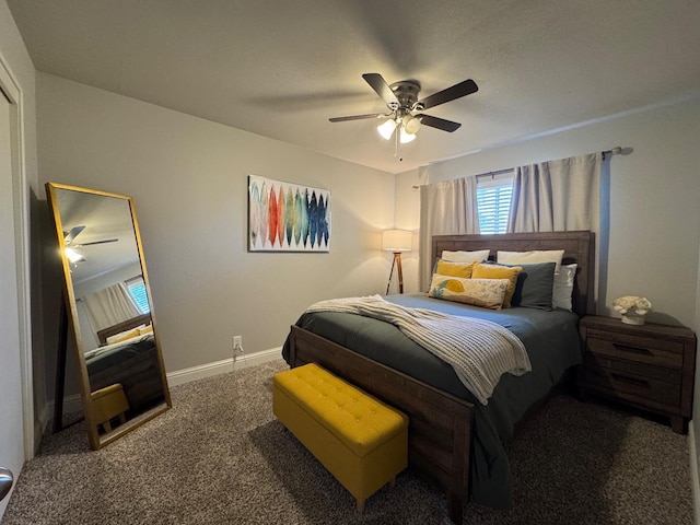 bedroom with dark carpet and ceiling fan