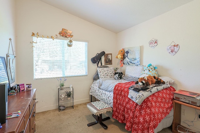 bedroom featuring light colored carpet and lofted ceiling