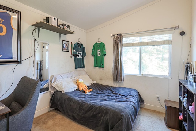 bedroom featuring light colored carpet and lofted ceiling