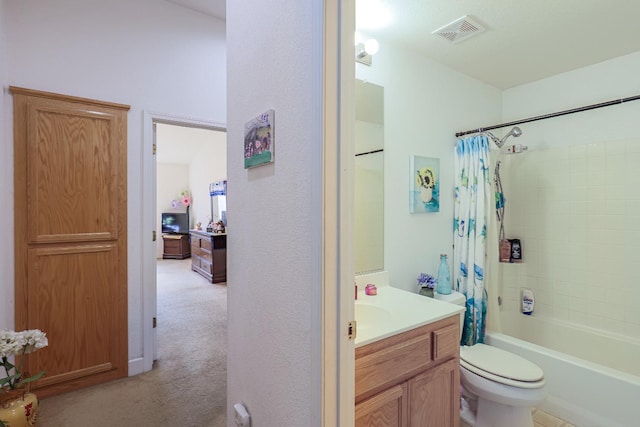 full bathroom with vanity, toilet, and shower / bath combo