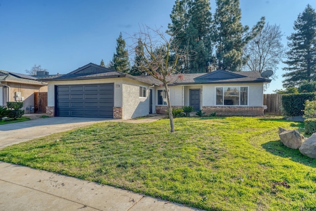 single story home featuring a garage and a front lawn