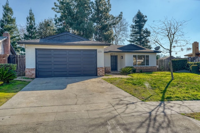 ranch-style house featuring a garage and a front lawn