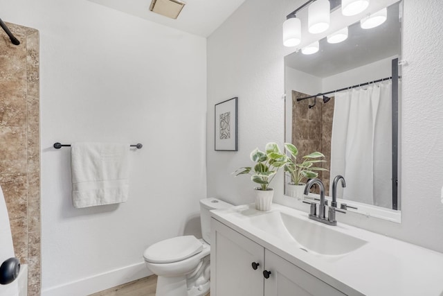 bathroom with a shower with curtain, hardwood / wood-style flooring, toilet, and vanity