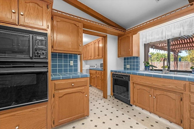 kitchen featuring black appliances, tasteful backsplash, tile countertops, and lofted ceiling