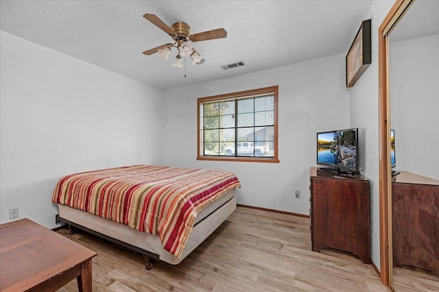 bedroom featuring ceiling fan and light hardwood / wood-style flooring