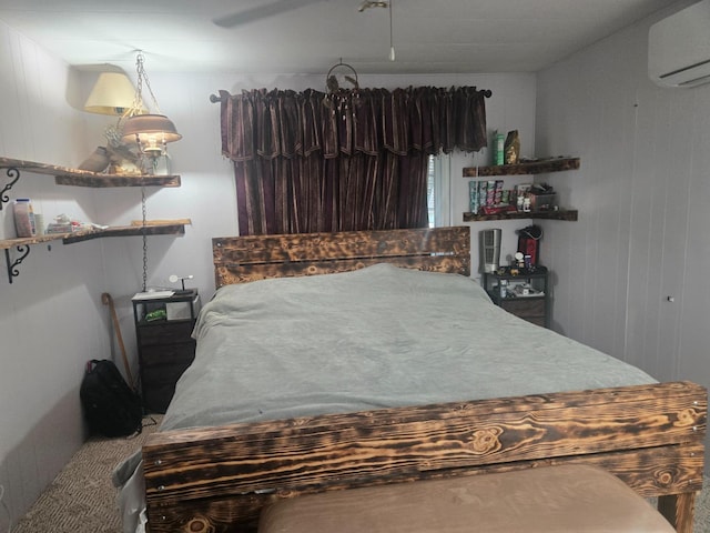 carpeted bedroom with wood walls and a wall mounted AC