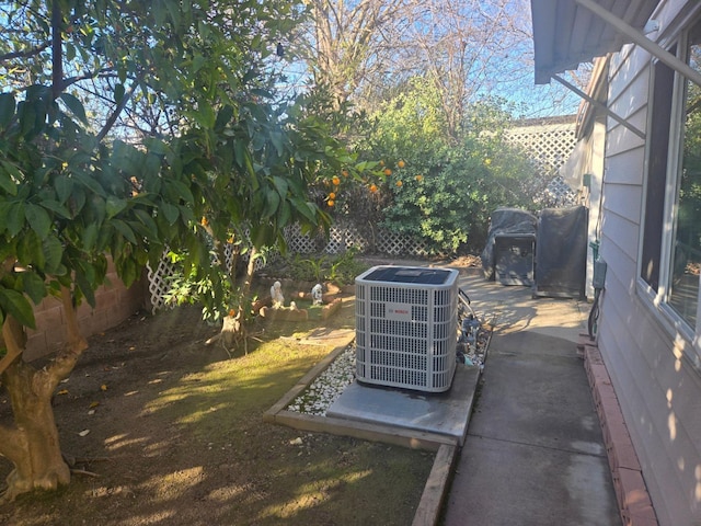 view of yard featuring central AC unit