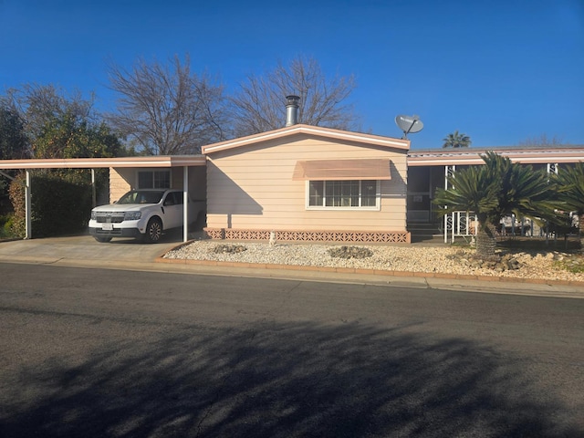 single story home with a carport