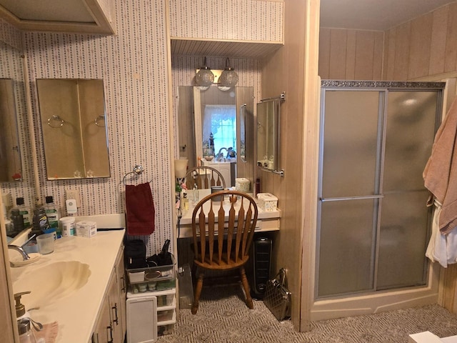 bathroom with an enclosed shower and vanity