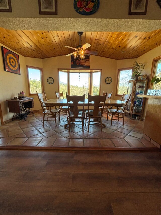 dining area featuring vaulted ceiling and ceiling fan