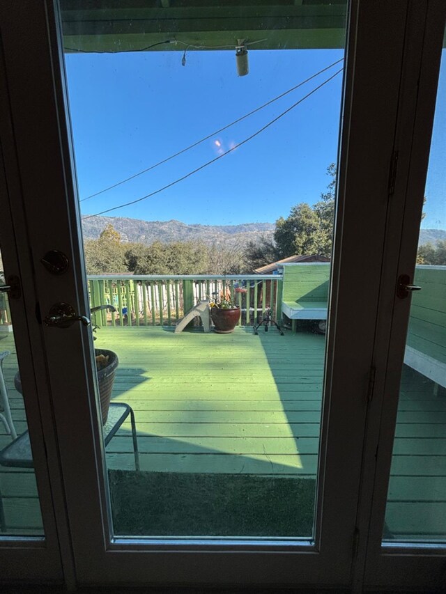 doorway to outside featuring a mountain view