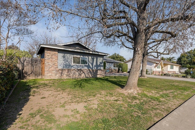 ranch-style house with a front lawn