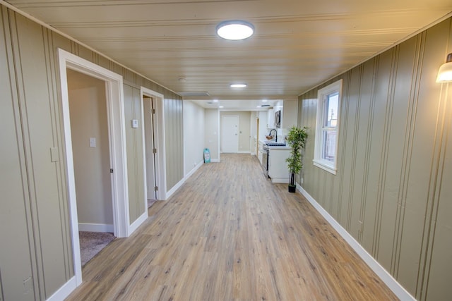 hall with light hardwood / wood-style flooring